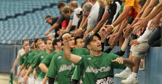 The Alleycats high five fans at the 2012 Championship final. (Photo by Lesa Nelson, Pics By Lesa)