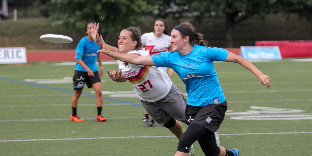 Meg Harris (Ozone #27) gets a layout D against Megan Cousins (All-Star Ultimate #17) during the 2015 All-Star Ultimate Tour. Photo by Christina Schmidt of Ultiphotos.