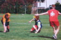 Kids playing flag football on a sunny field, learning the game in 1989.